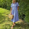 New button-up dress with striped flaps at the bottom | With functional pockets